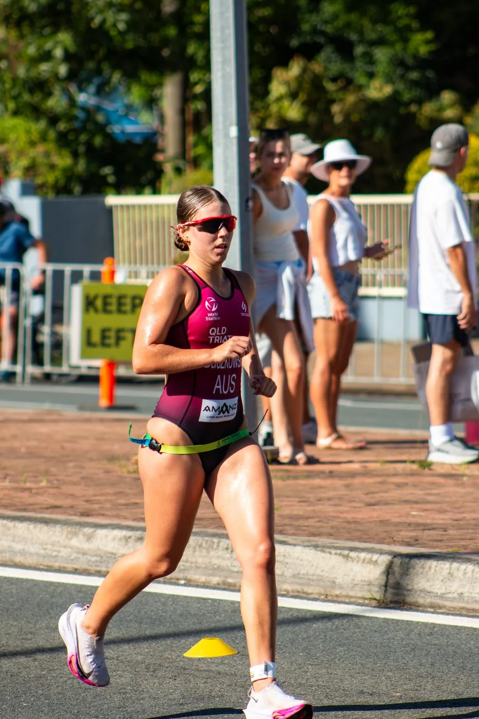 Triathlon female runner mid-stride